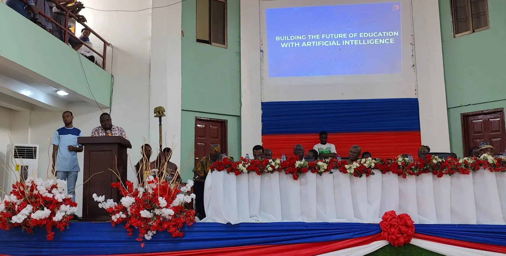 Kingsley Aidoo delivering the keynote at the GNAPS 2025 theme launch, under the slide ‘Building the future of education with artificial intelligence’