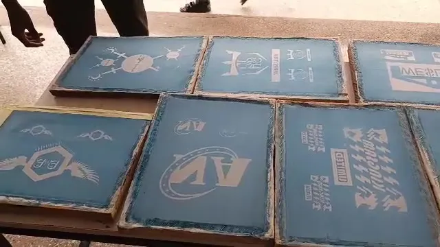 Screen-printing frames laid out on a table